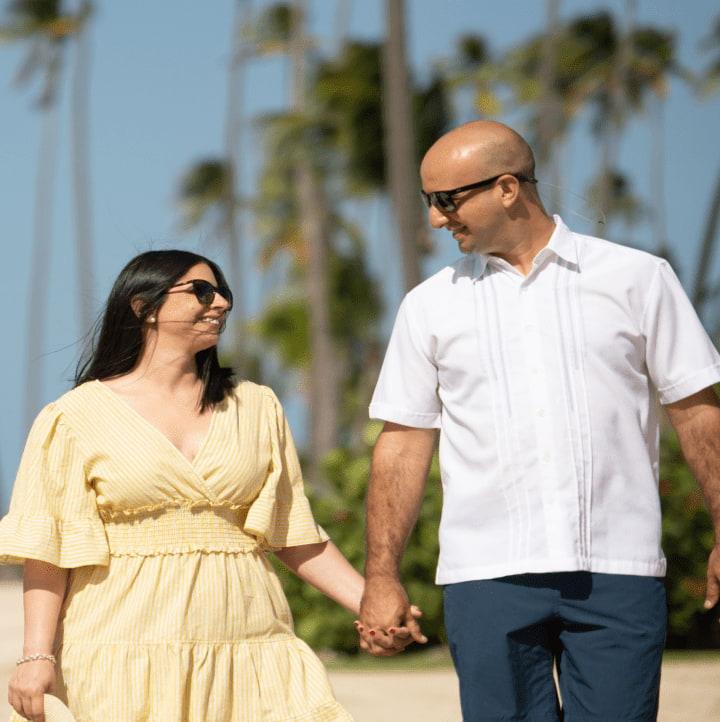 Couple walking on the beach, Hero Image